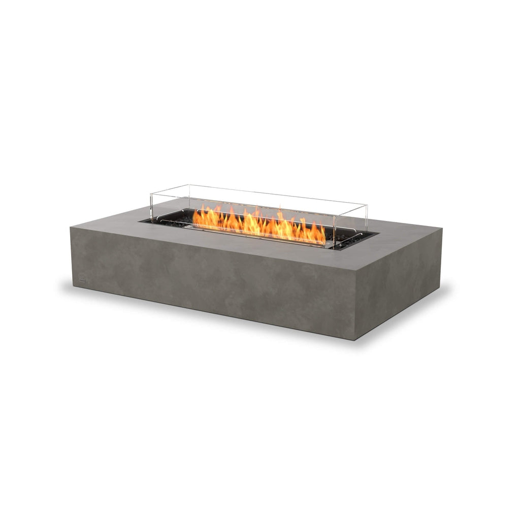 EcoSmart Fire Wharf 65 ethanol fire pit table in grey concrete with a rectangular glass screen and orange flames.