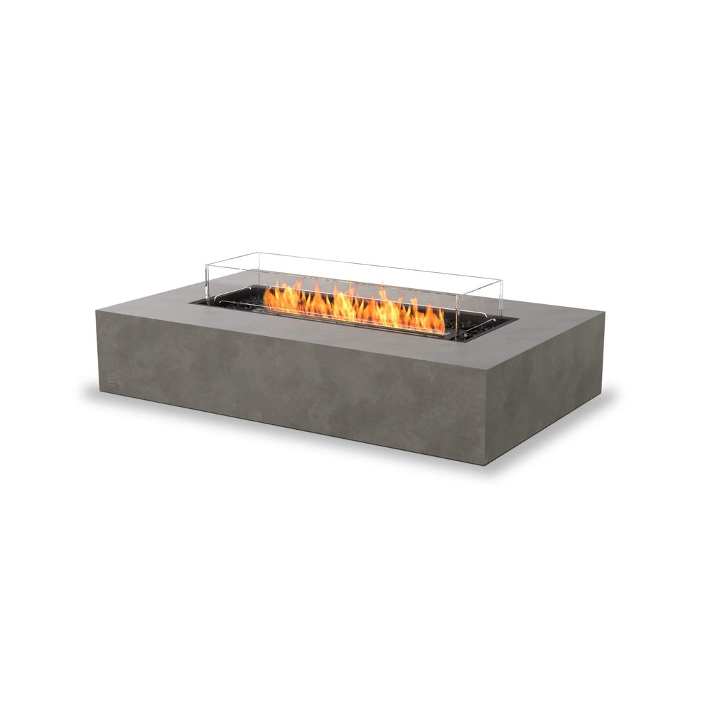EcoSmart Fire Wharf 65 ethanol fire pit table in grey concrete with a rectangular glass screen and orange flames.