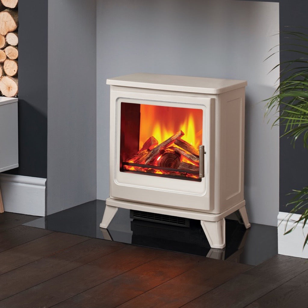 Cream-coloured Solution Fires Blackthorn electric stove with a realistic log flame effect, set on a black hearth.