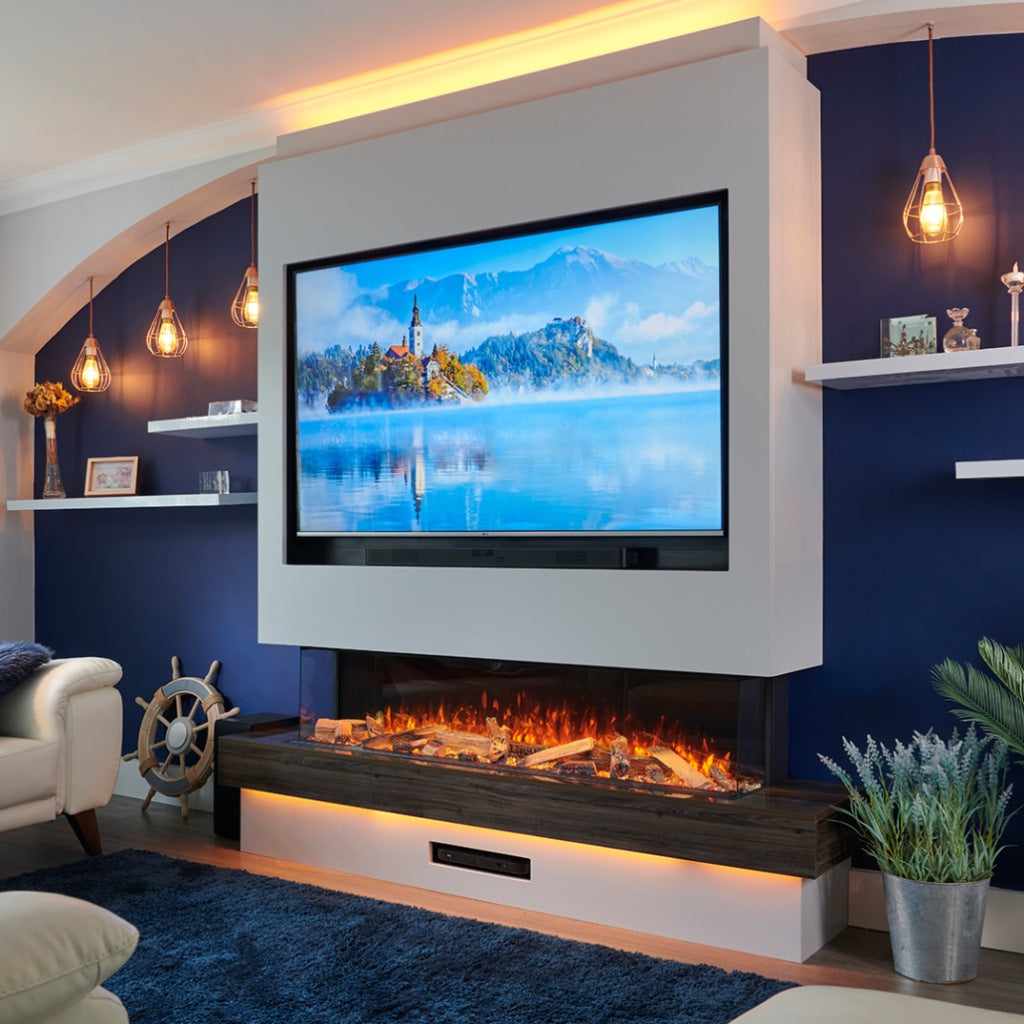 Solution SLE125 HD 1250mm three-sided electric fire in a media wall with a dark wood shelf and glowing log flame effect.