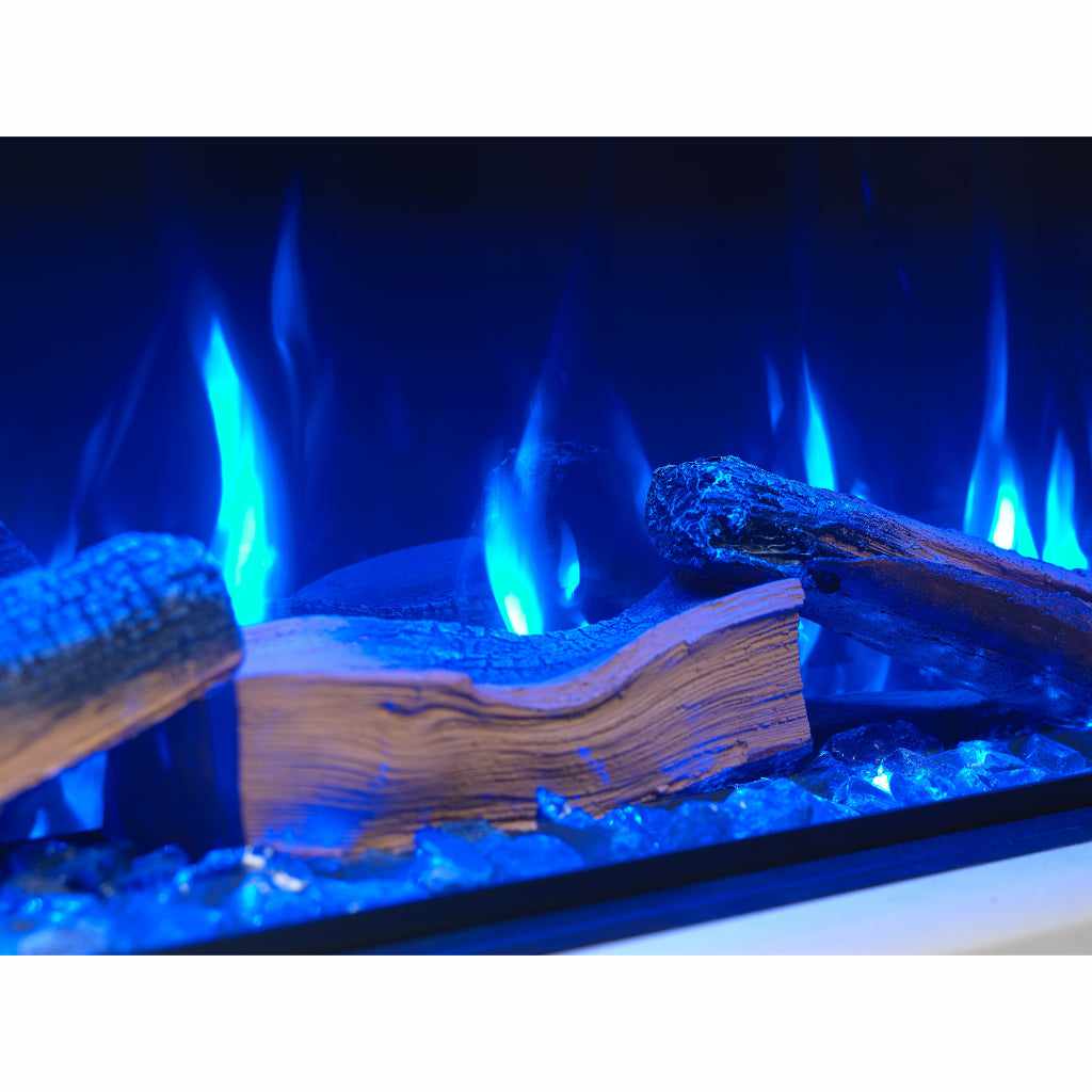 Vision Futura 1300 electric fire with realistic logs and glowing blue flames set against a dark background.