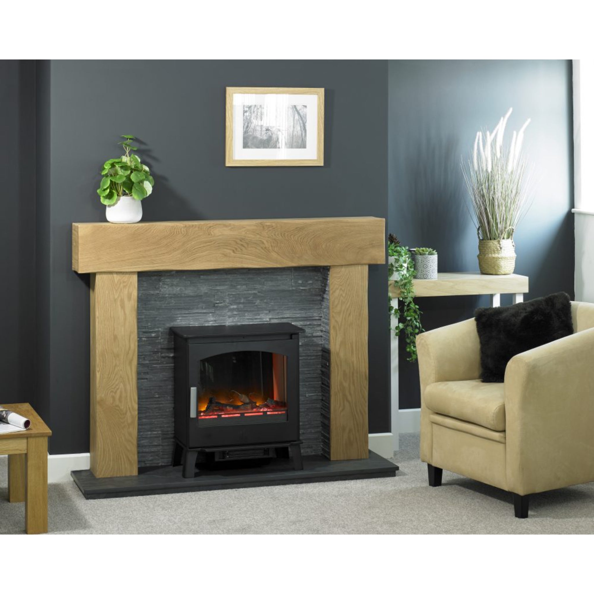 ACR Astwood HD electric stove in black, set within a rustic oak mantel and grey slate-effect fireplace surround.