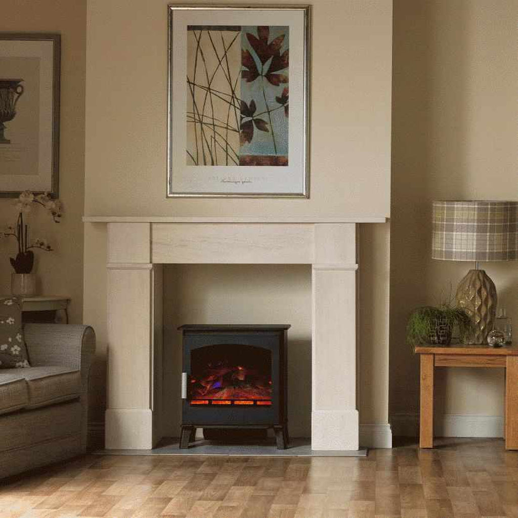 ACR Astwood HD Electric Stove in black, featuring a glowing flame effect, positioned inside a light stone fireplace.