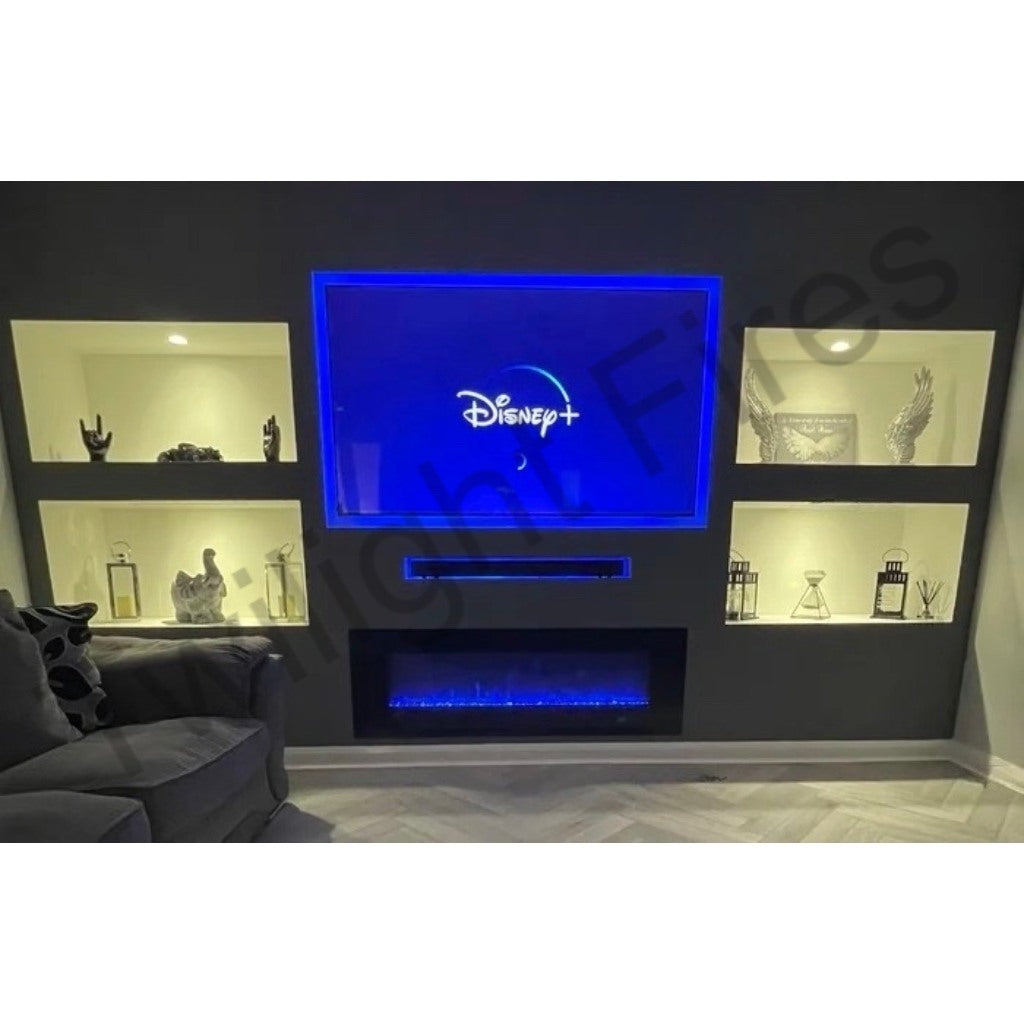 Aurora 72 Inch Media Wall Electric Fire Insert with blue LED flames, mounted below a TV in a dark grey feature wall.