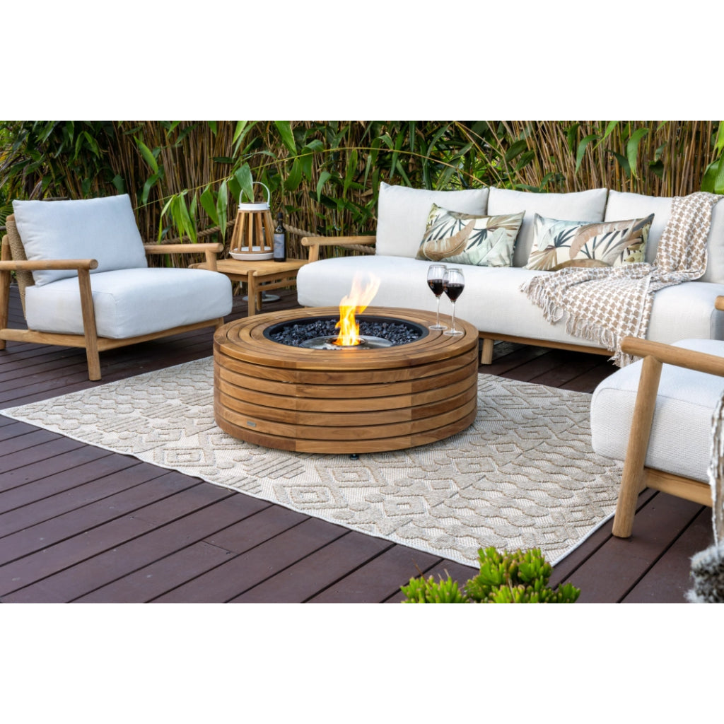EcoSmart Fire Ark 40 bioethanol fire pit table with a circular slatted teak wood frame on a patio deck.
