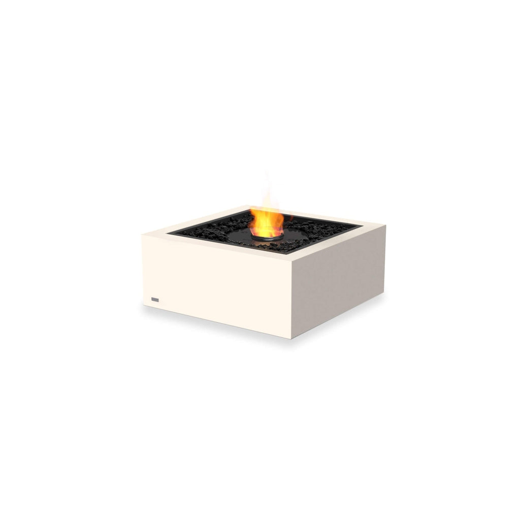 EcoSmart Fire Base 30 bioethanol fire pit in cream with black decorative stones and a central flame on white background.