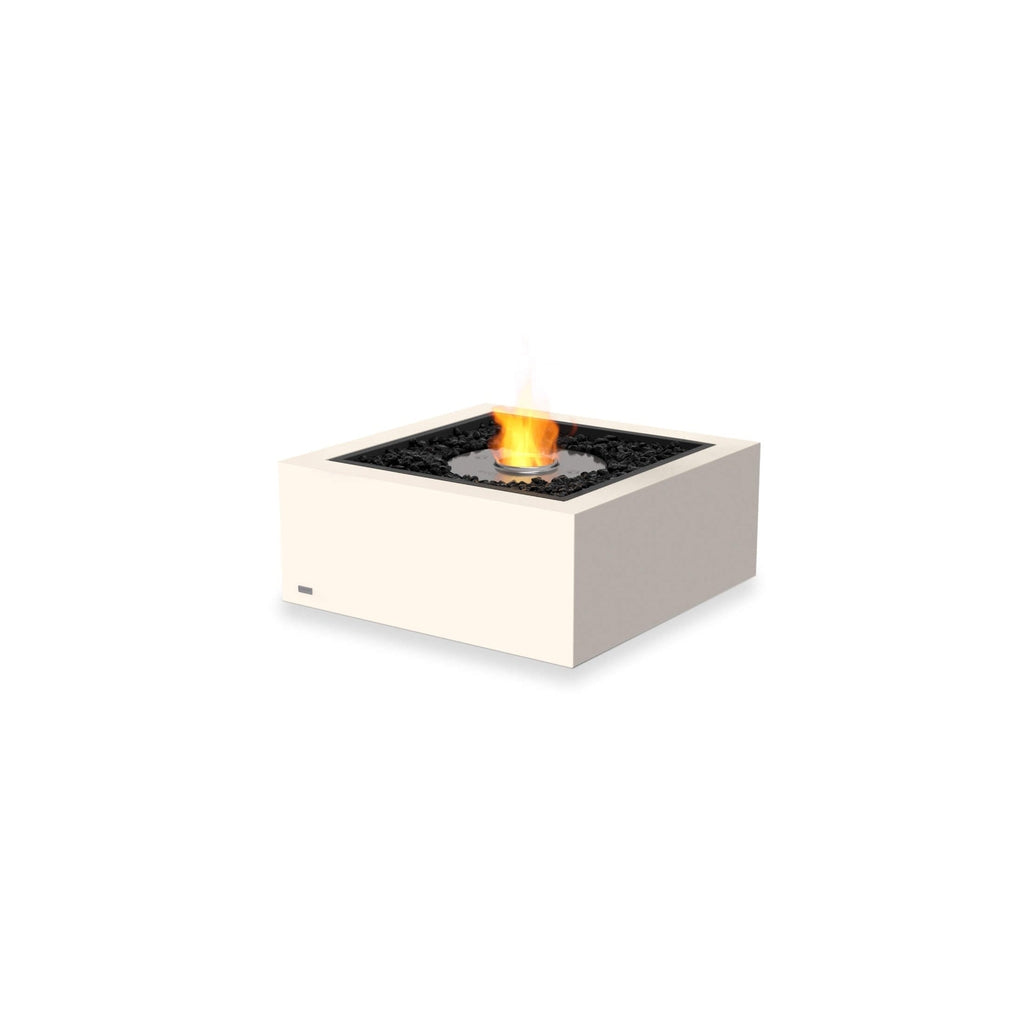 EcoSmart Fire Base 30 bioethanol fire pit with a square cream frame, black lava rocks, and a central flame.