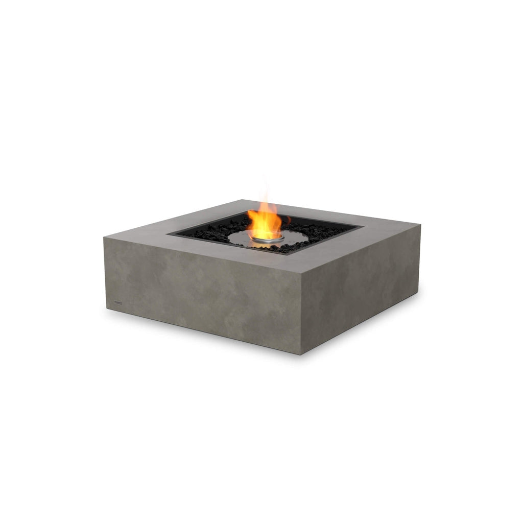 EcoSmart Fire Base 40 square concrete-effect fire pit table with a central bioethanol flame and black decorative stones.