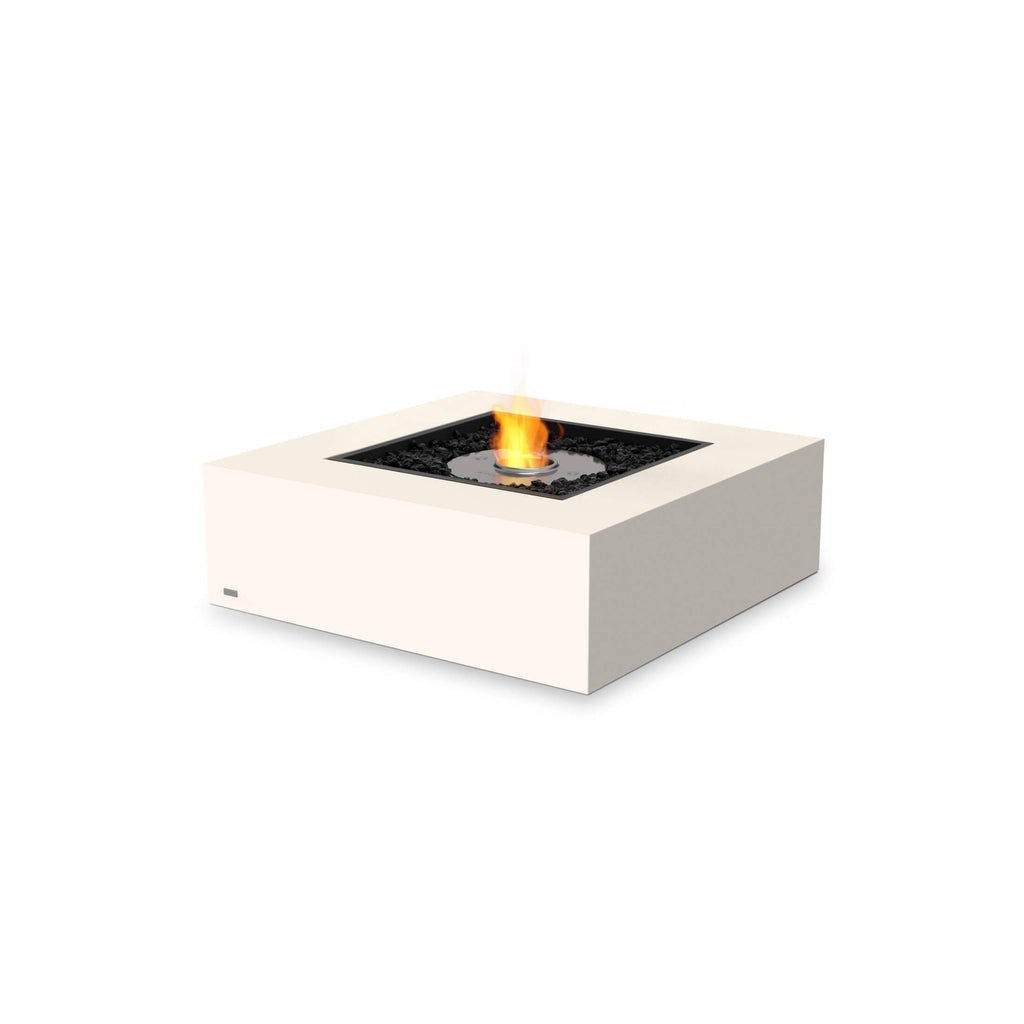 EcoSmart Fire Base 40 square fire pit table in off-white with a central burner and black decorative stones.