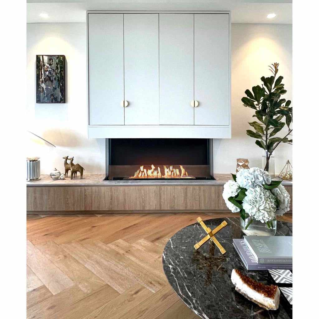 EcoSmart Fire Flex 68 bioethanol fireplace with a black frame set into a light wood and white cabinetry wall.