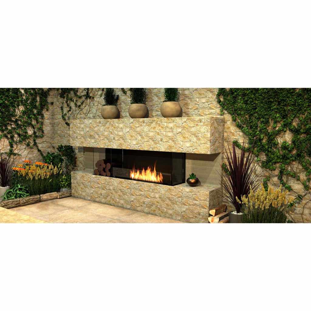 EcoSmart Fire Flex 68 bioethanol fireplace set in a rustic stone wall with a linear flame and glass surround.