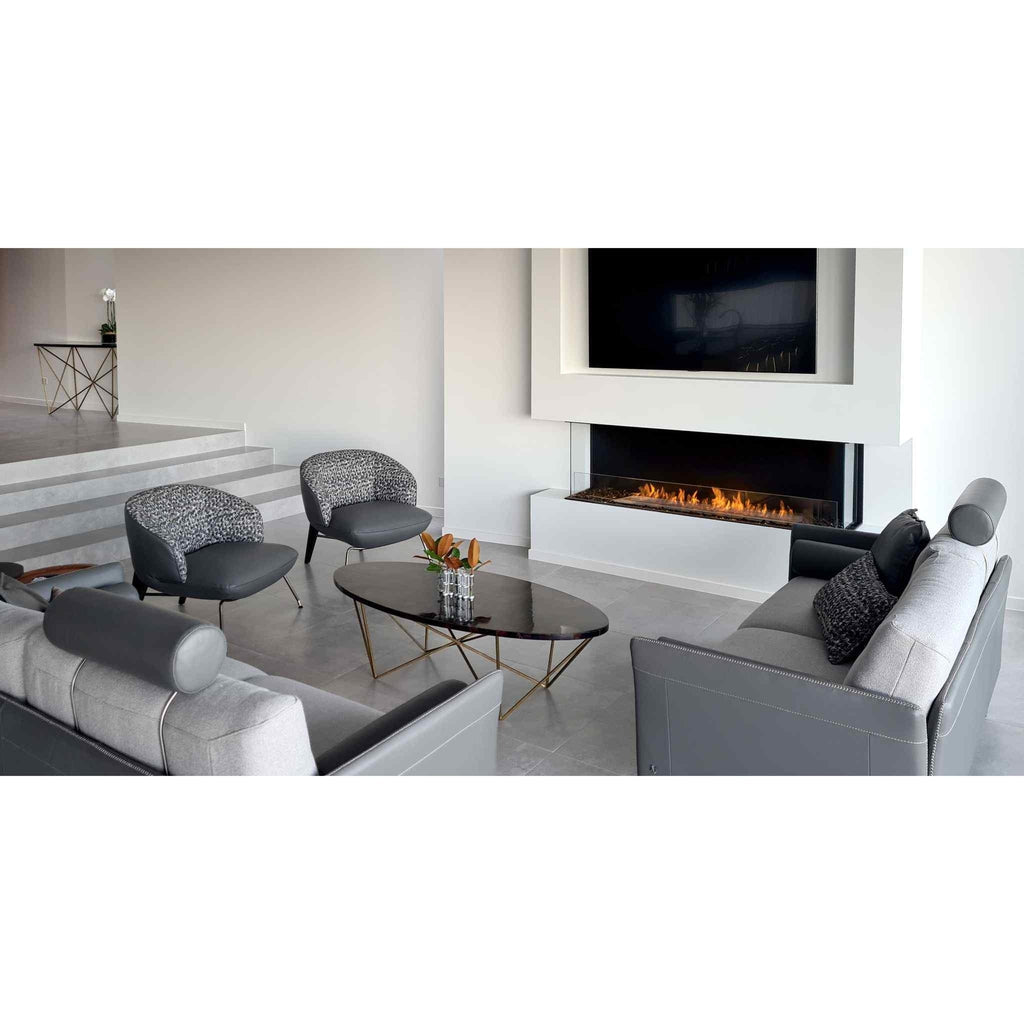 EcoSmart Fire Flex 68 bioethanol fireplace insert set into a white wall below a television in a modern living room.