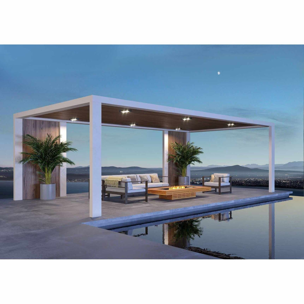 EcoSmart Fire Gin 90 low wooden bioethanol fire pit table on a modern poolside patio at dusk.