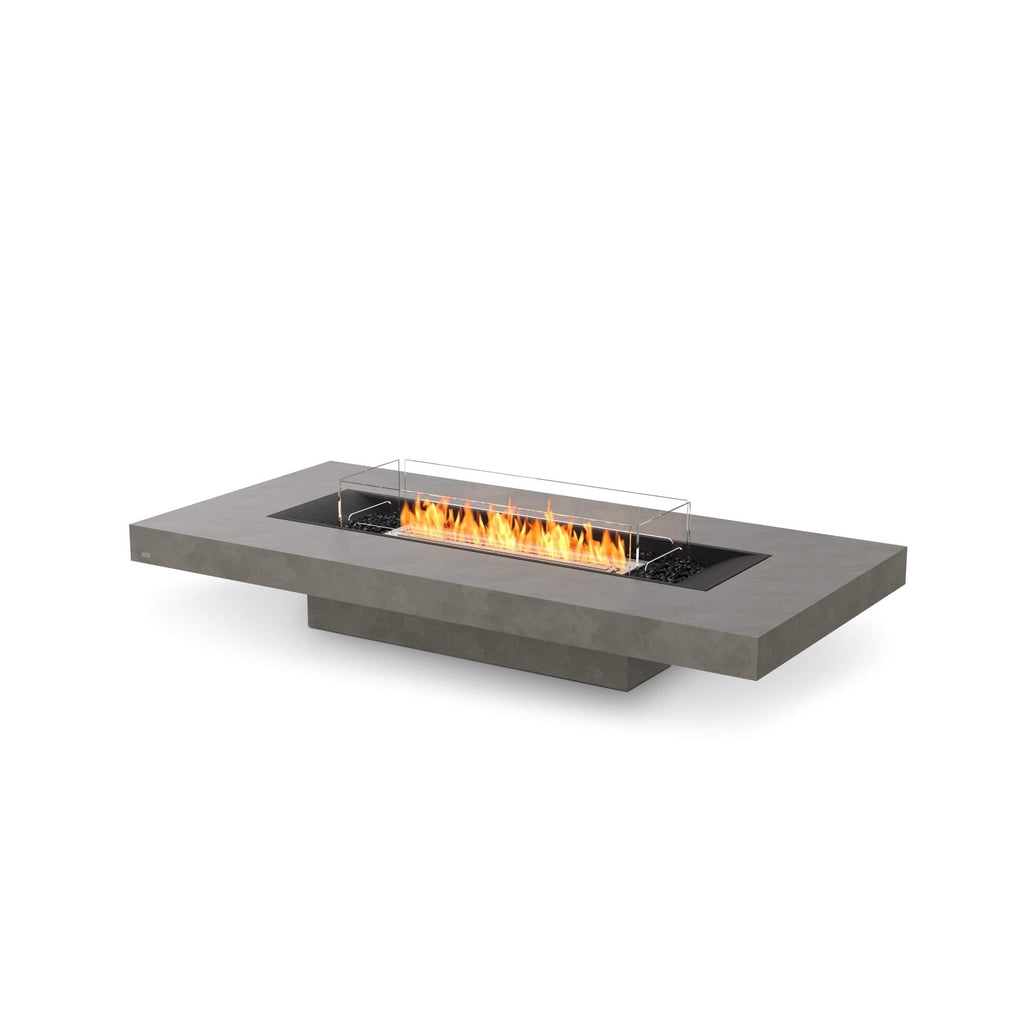 EcoSmart Fire Gin 90 low rectangular grey concrete fire pit table with a central flame and glass wind guard.