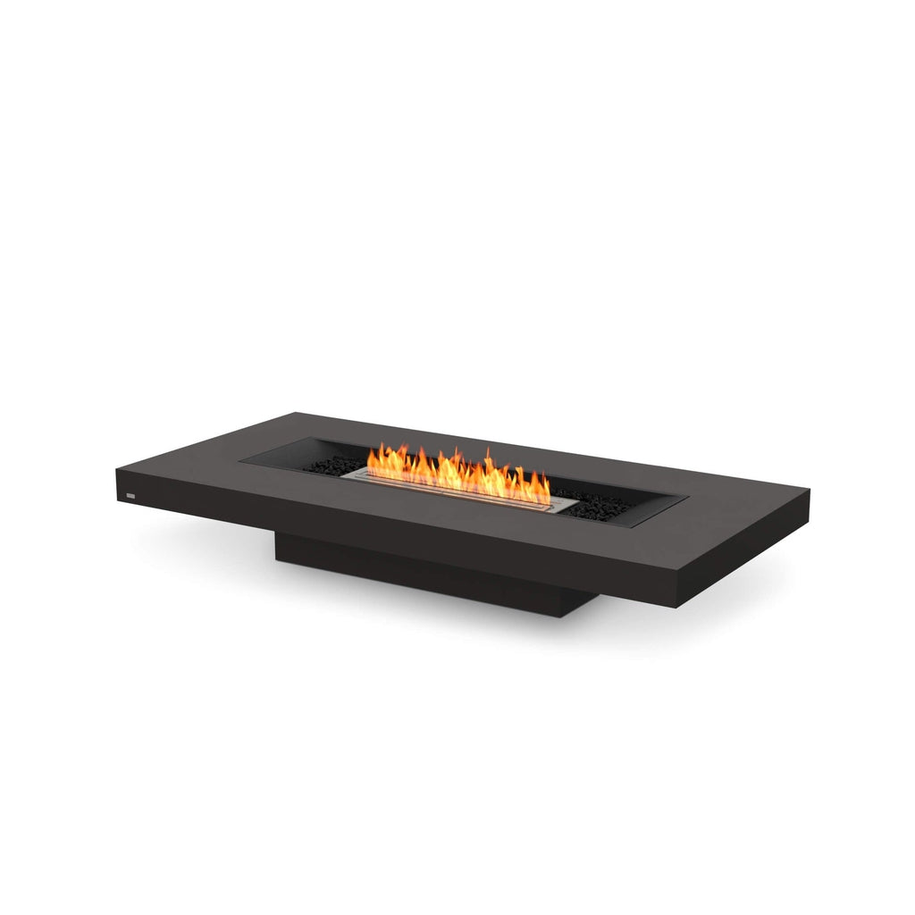 EcoSmart Fire Gin 90 low rectangular black bioethanol fire pit table with a central flame and black decorative stones.