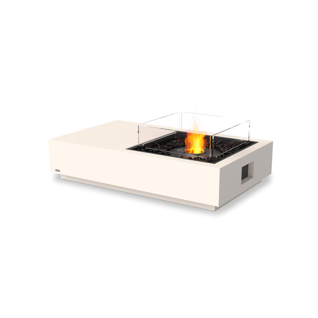 EcoSmart Fire Manhattan 50 bioethanol fire pit table in cream with a glass screen and black decorative stones.