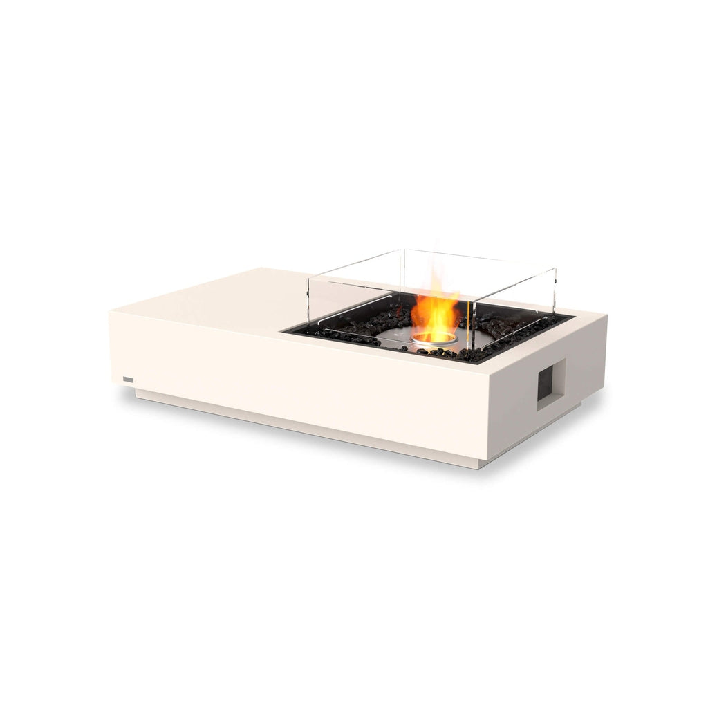 EcoSmart Fire Manhattan 50 bioethanol fire pit table in cream with a glass screen and black decorative stones.