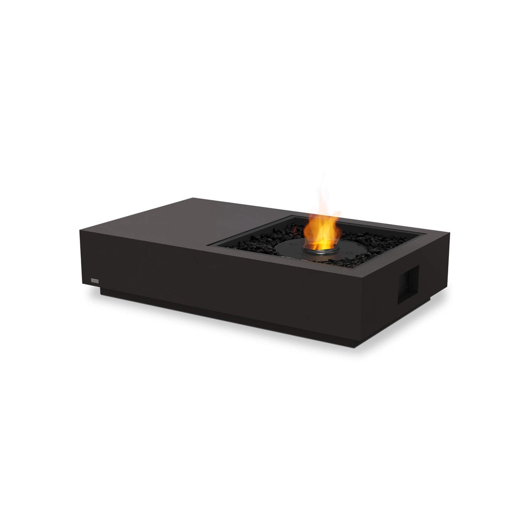 EcoSmart Fire Manhattan 50 bioethanol fire pit table in black with a central flame and black decorative stones.