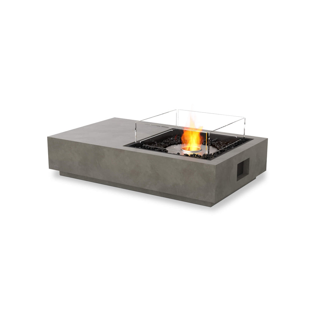 EcoSmart Fire Manhattan 50 bioethanol fire pit table in grey concrete with a glass screen and burning flame.