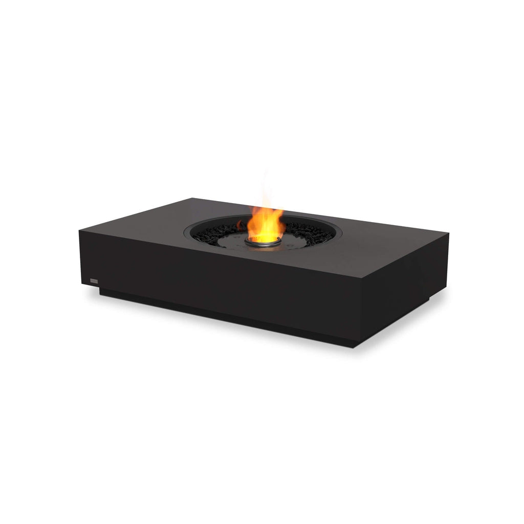 EcoSmart Fire Martini 50 bioethanol fire pit table in matte black with a central flame and black decorative stones.