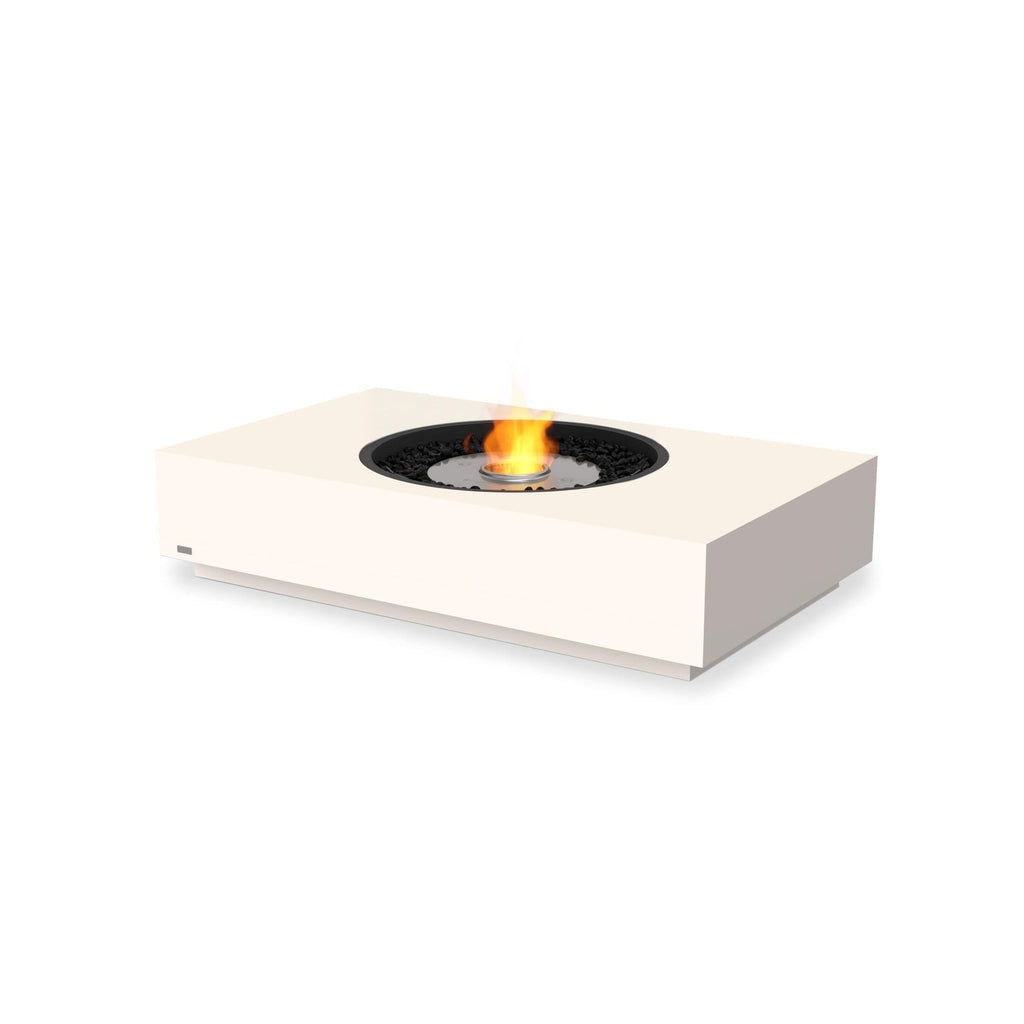 EcoSmart Fire Martini 50 bioethanol fire pit table in cream with a central burner and black decorative stones.
