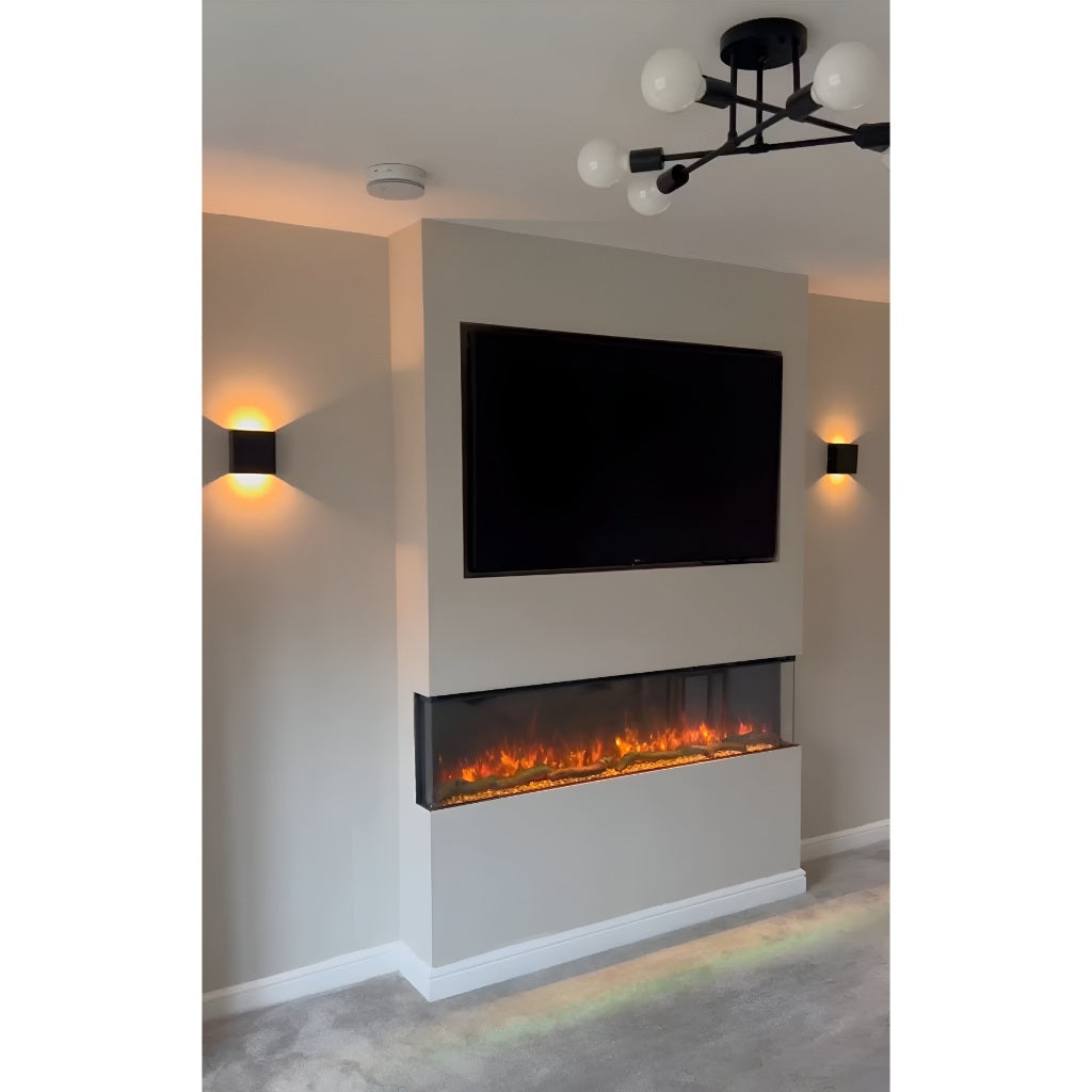 Luvelle 71” 3D panoramic electric fire built into a beige chimney breast with a wall-mounted TV above.
