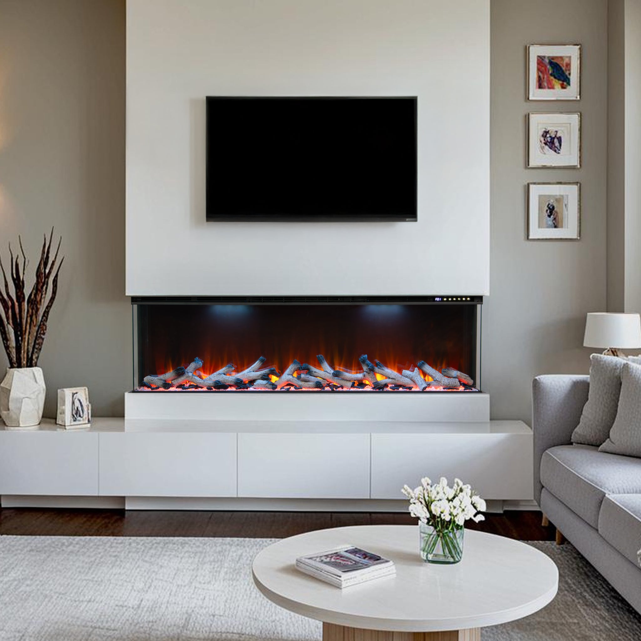 Maison 50 inch 3-sided panoramic electric fire insert with realistic glowing logs set in a modern white media wall.