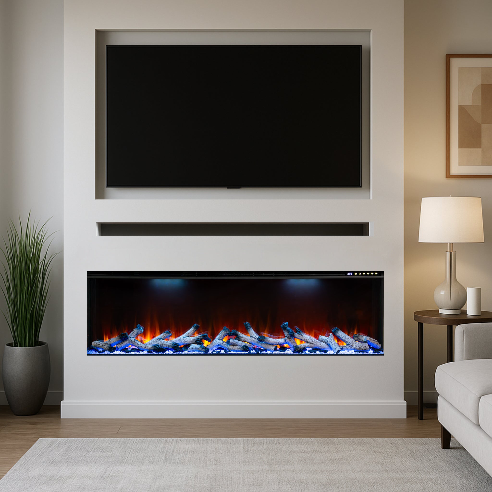 Maison 50 Inch 3 Sided Panoramic HD+ Media Wall Electric Fire with glowing logs and blue and orange flames in a white wall.