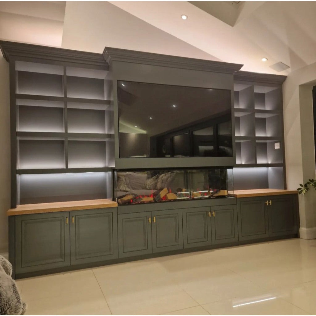Vision Futura 1300 electric fire in a grey media wall with integrated shelving, cupboards, and a mounted television.