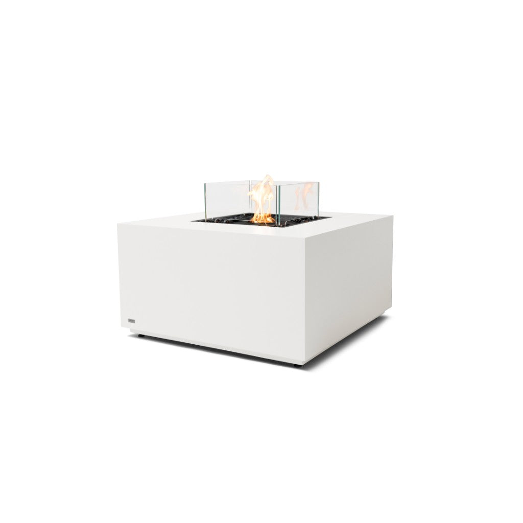 EcoSmart Fire Chaser 38 bioethanol fire pit table in white with a square base and glass flame guard.