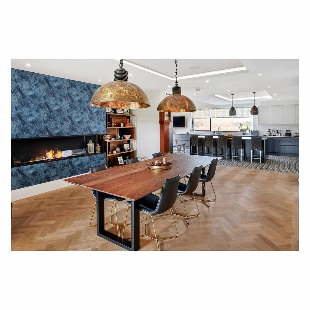EcoSmart Fire Flex 104 bioethanol fireplace set in a blue marble-effect wall within a modern open-plan dining room.
