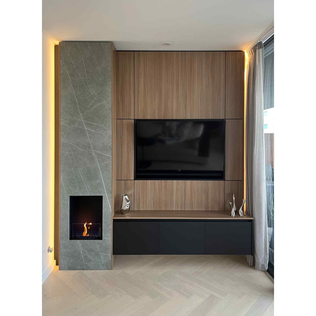 EcoSmart Fire Flex 18 bioethanol fireplace insert set in a grey marble surround with warm LED backlighting.