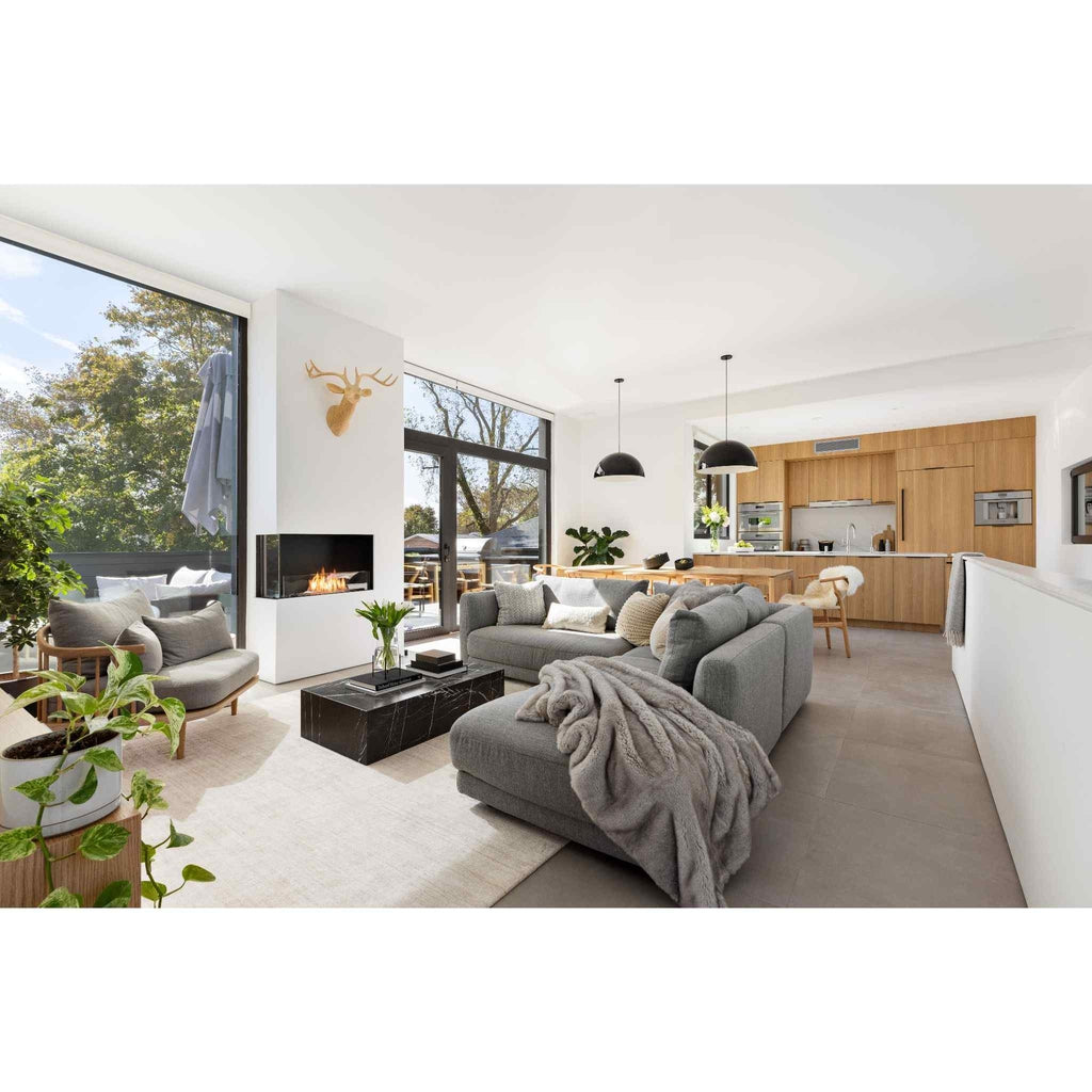 EcoSmart Fire Flex 18 bioethanol fireplace insert installed in a white wall within a modern open-plan living room.