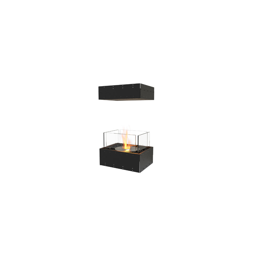 EcoSmart Fire Flex 18 bioethanol fireplace with a black frame, glass screen, and a central flame on black pebbles.