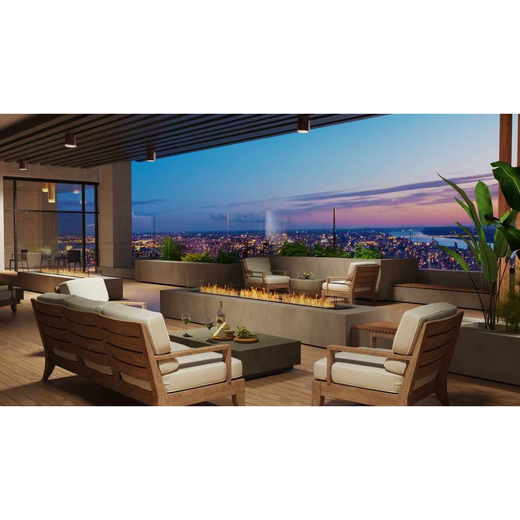 EcoSmart Fire Flex 32 bioethanol fireplace insert set in a grey concrete hearth on a modern outdoor terrace.