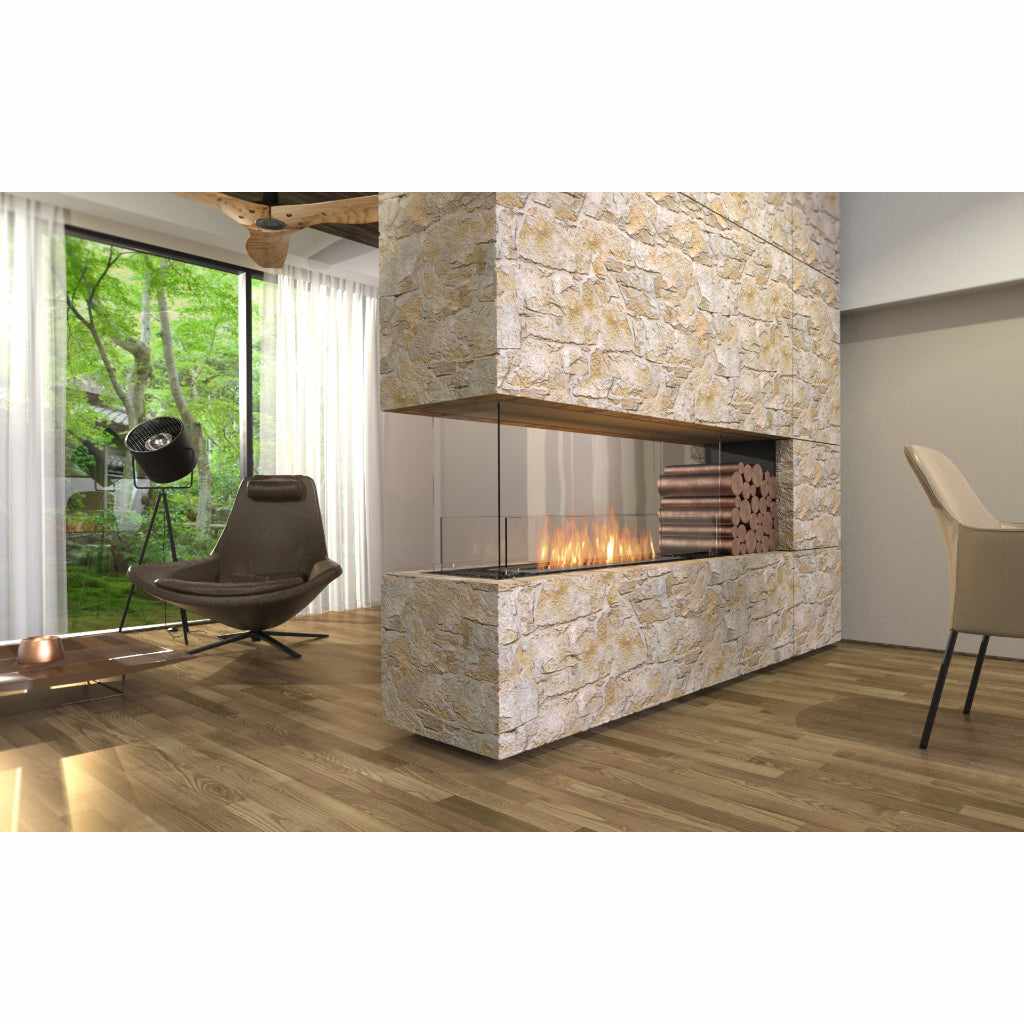EcoSmart Fire Flex 32 bioethanol fireplace insert set in a stone-clad room divider with a visible flame and log storage.