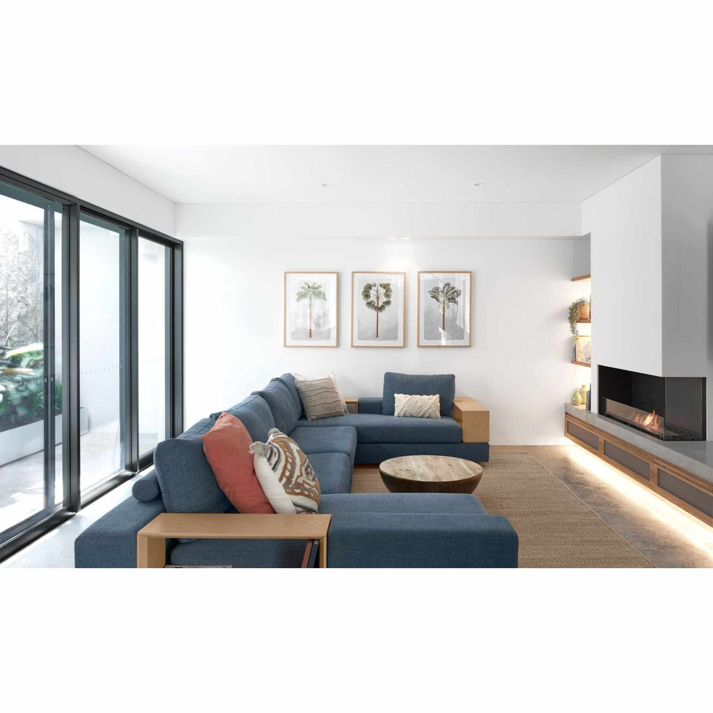 EcoSmart Fire Flex 42 bioethanol fireplace insert installed in a modern white wall above a wooden storage unit.