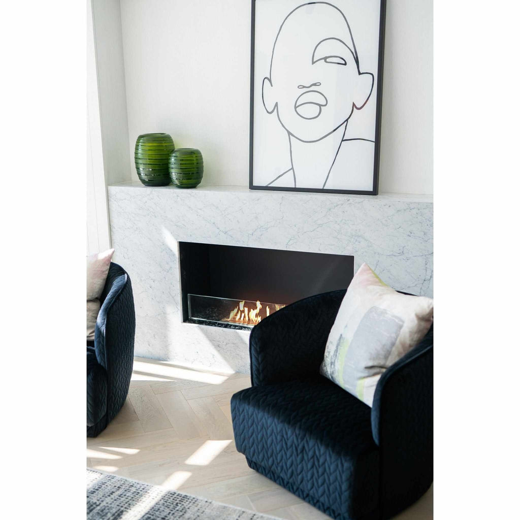 EcoSmart Fire Flex 42 bioethanol fireplace set in a white marble surround with a black interior and glass screen.