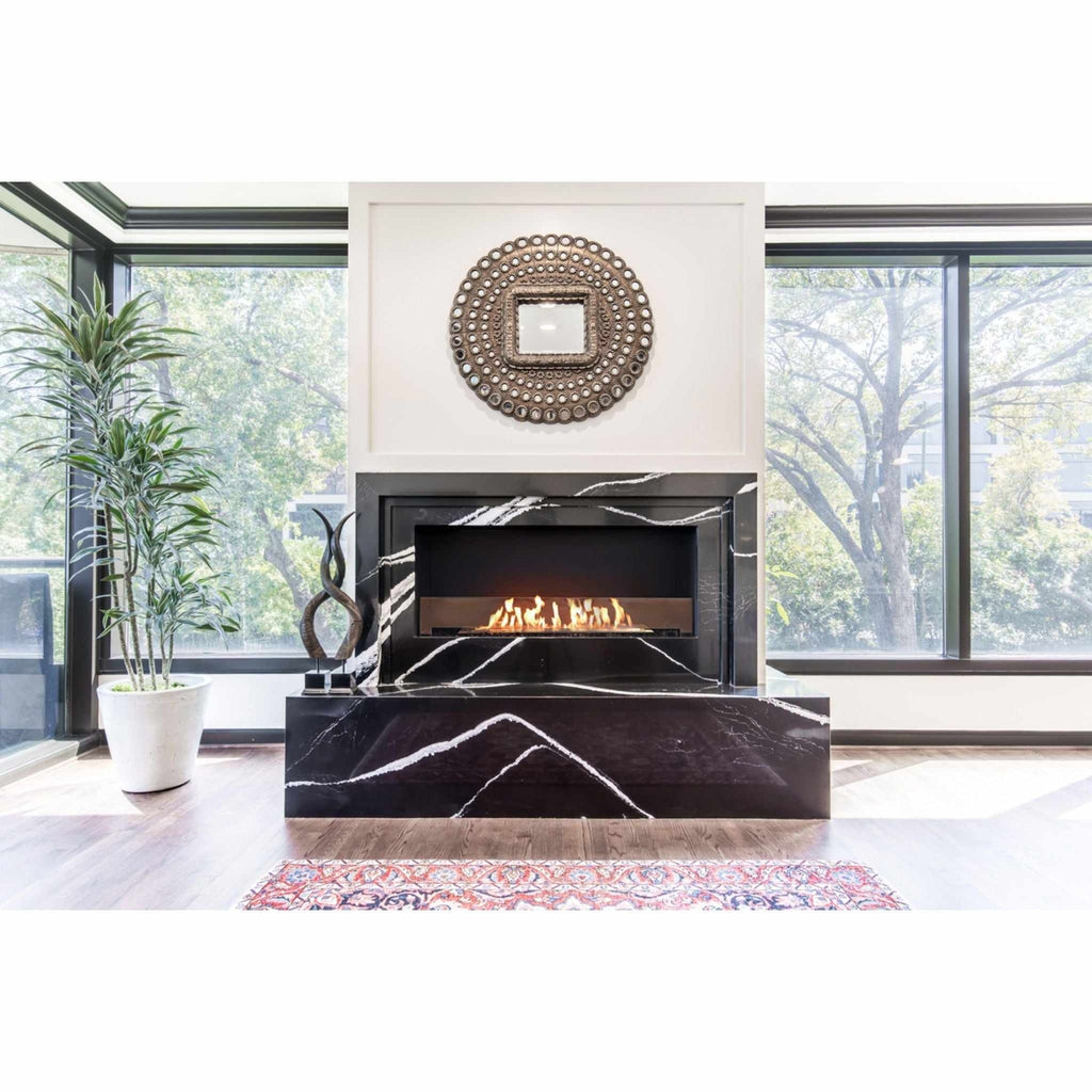 EcoSmart Fire Flex 42 bioethanol fireplace insert set in a black and white marble surround with a linear flame.