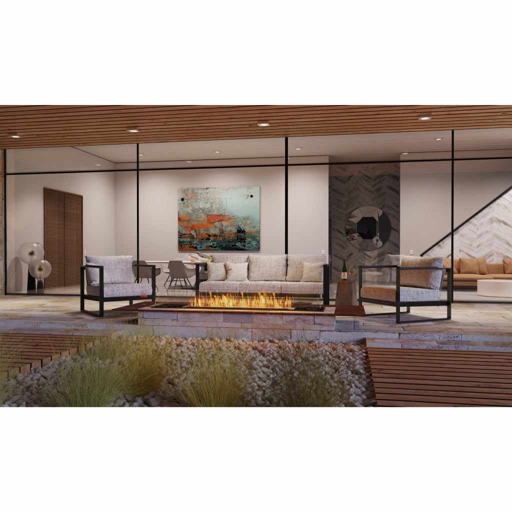 EcoSmart Fire Flex 60 bioethanol fireplace insert with a long, linear flame in a modern outdoor patio setting.