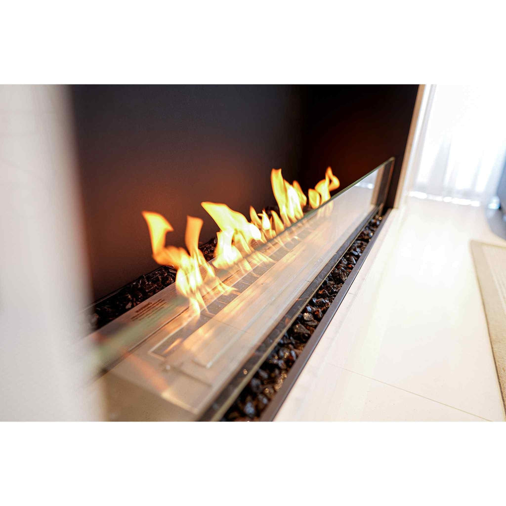 EcoSmart Fire Flex 78 bioethanol fireplace with a long linear flame, glass screen, and black decorative stones.