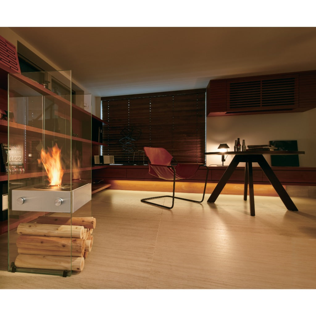 EcoSmart Fire Ghost bioethanol fireplace with glass panels and a stack of logs in a modern living room.