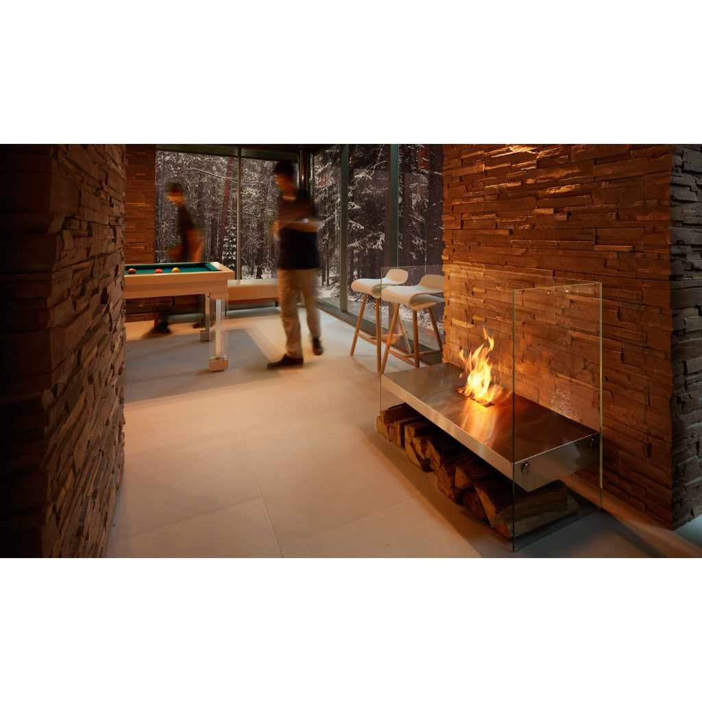EcoSmart Fire Igloo bioethanol fireplace with a stainless steel burner and glass screen in a modern room.