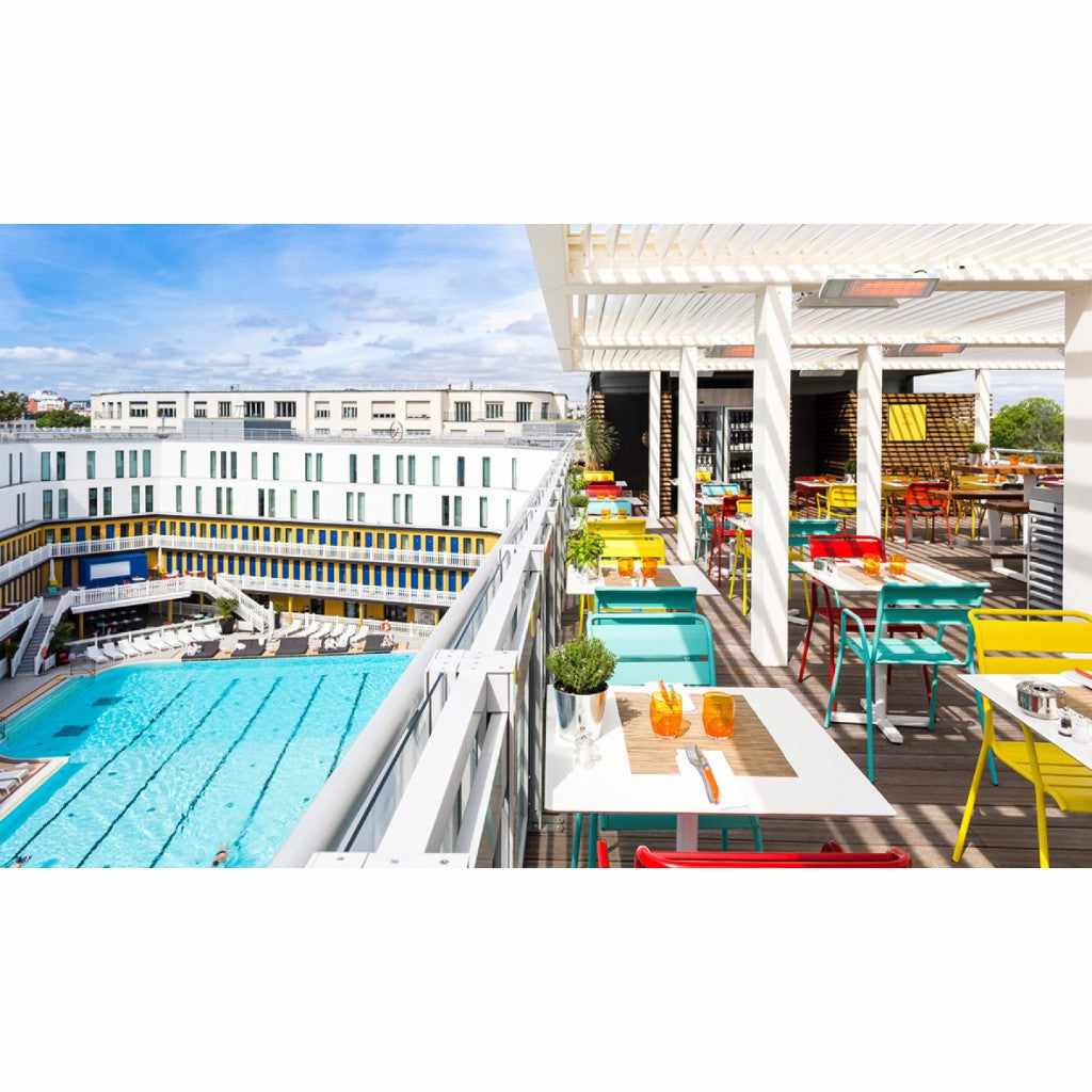 Heatscope Heaters Spot 1600W electric radiant heater mounted on a white pergola above an outdoor terrace by a pool.