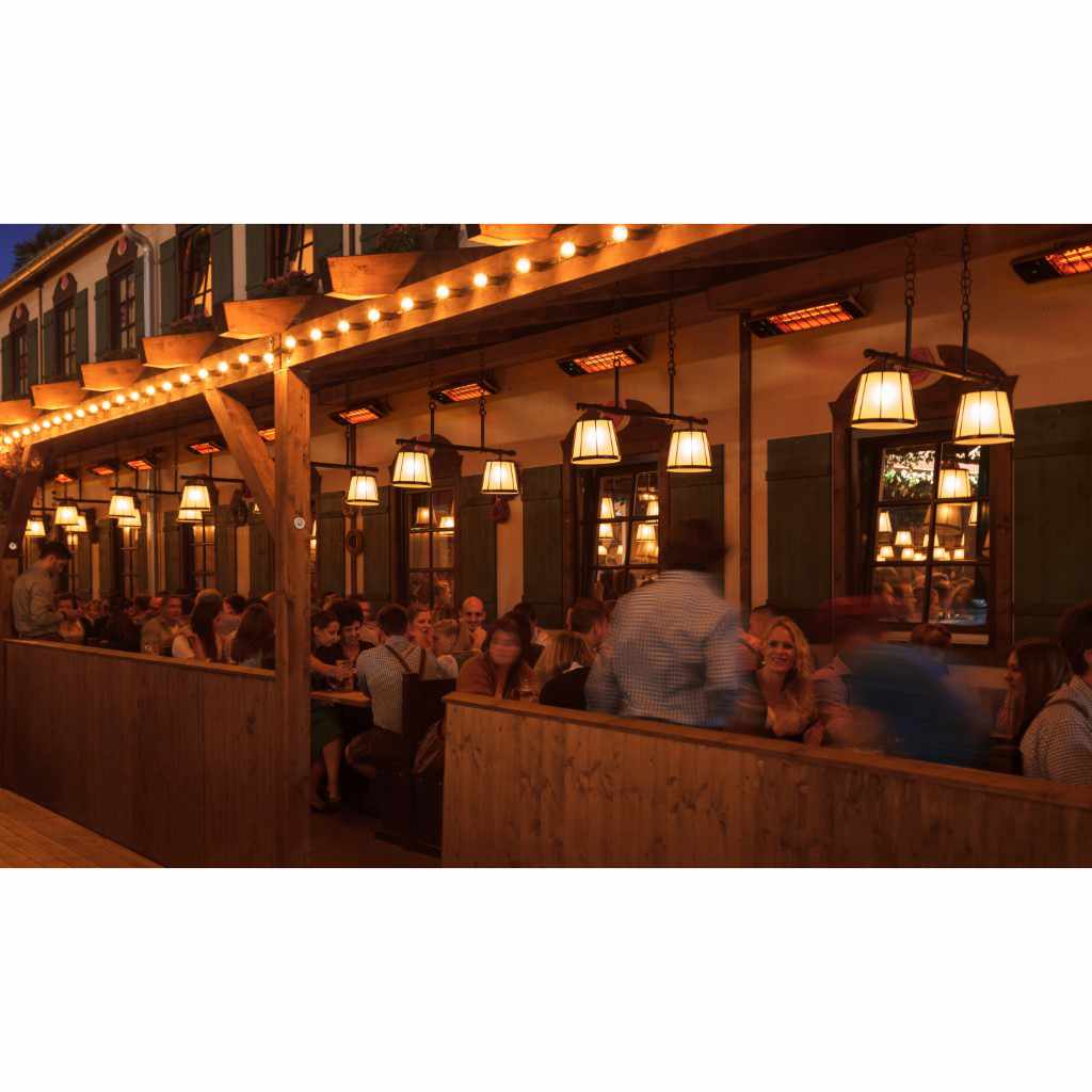 Heatscope Heaters Spot 1600W electric radiant heaters mounted on a wooden outdoor restaurant terrace at night.