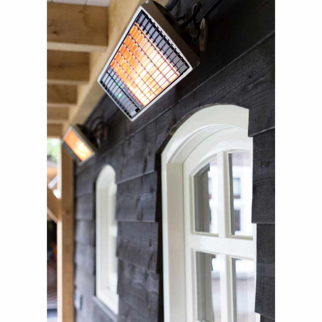 Heatscope Heaters Spot 2800W electric radiant heater mounted on a dark timber wall above white arched windows.