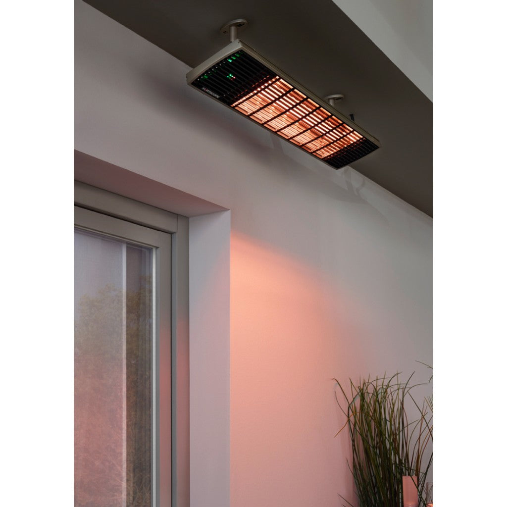 Heatscope Heaters Spot 2800W electric radiant heater mounted on a ceiling, glowing orange with a black grille.