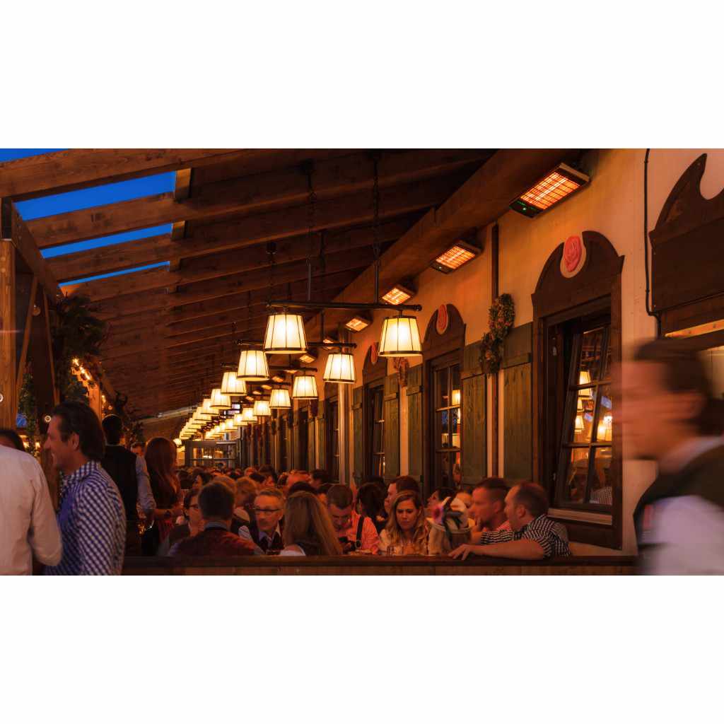 Heatscope Heaters Spot 2800W electric radiant heaters mounted on a restaurant patio wall above seated diners.
