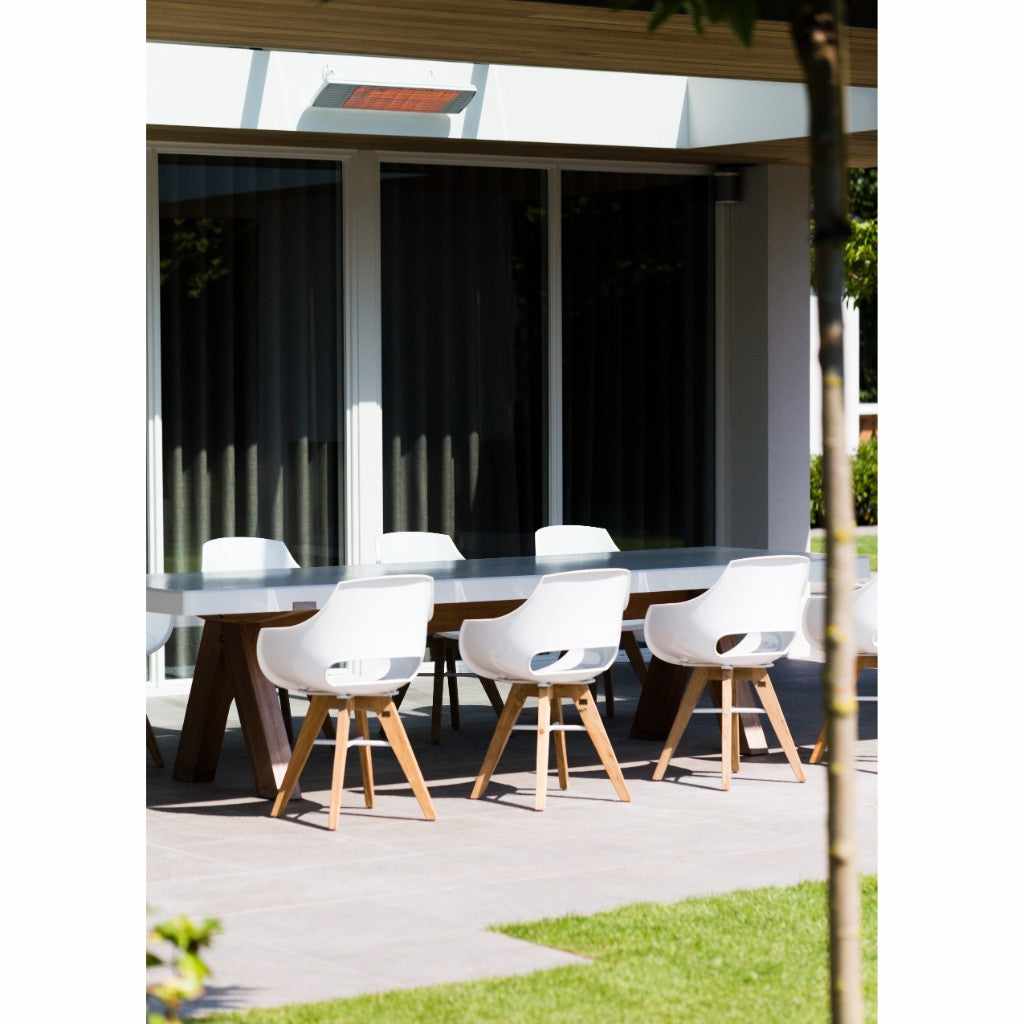 Heatscope Heaters Spot 2800W electric radiant heater mounted on a patio ceiling above a modern outdoor dining set.