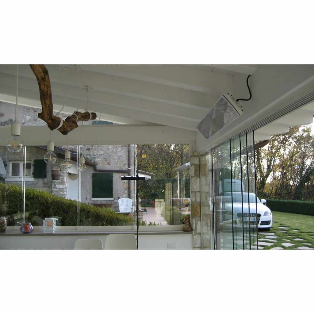 Heatscope Heaters Vision 3200w electric radiant heater mounted on a white ceiling in a glass-enclosed patio.